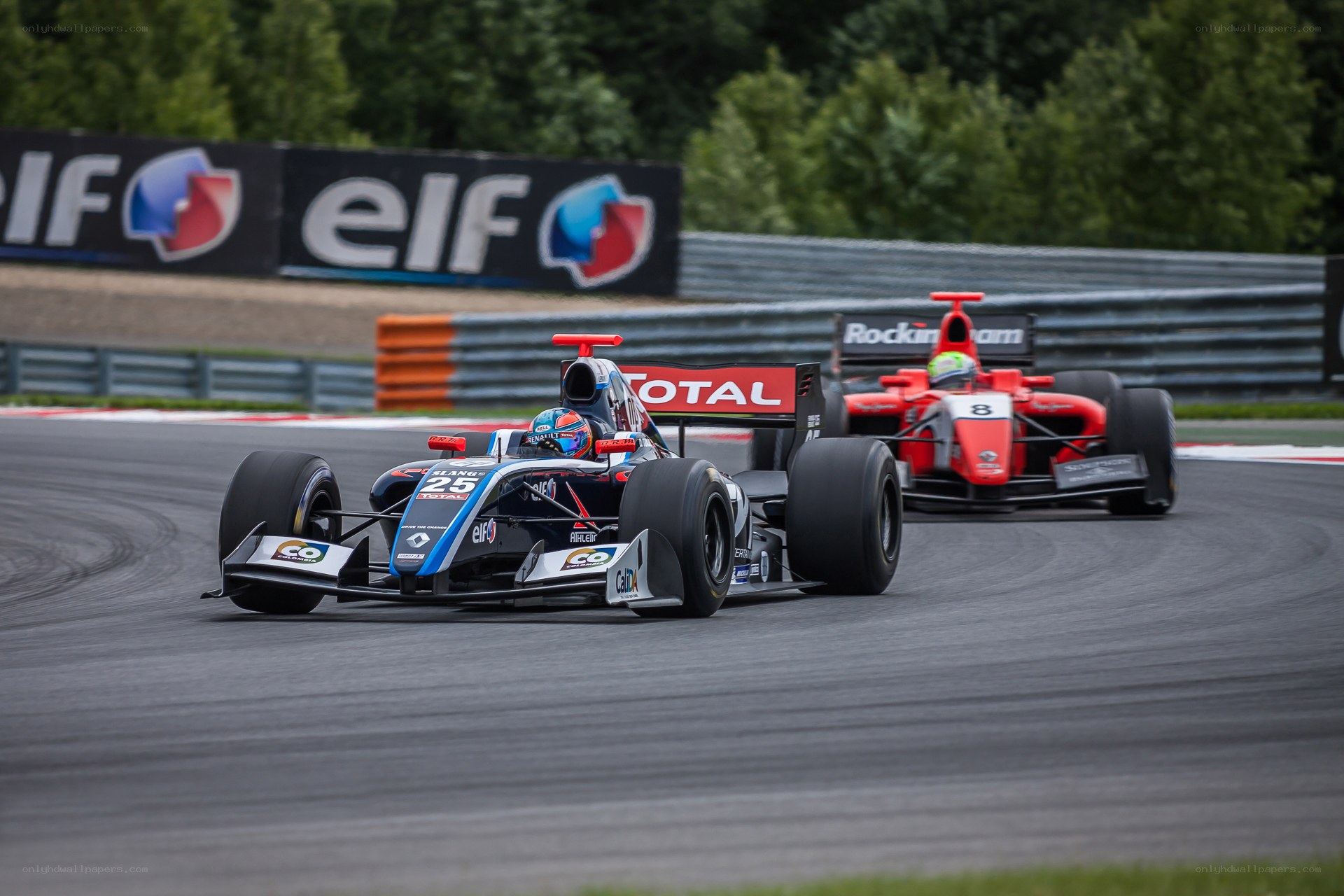 Formula cars racing on track