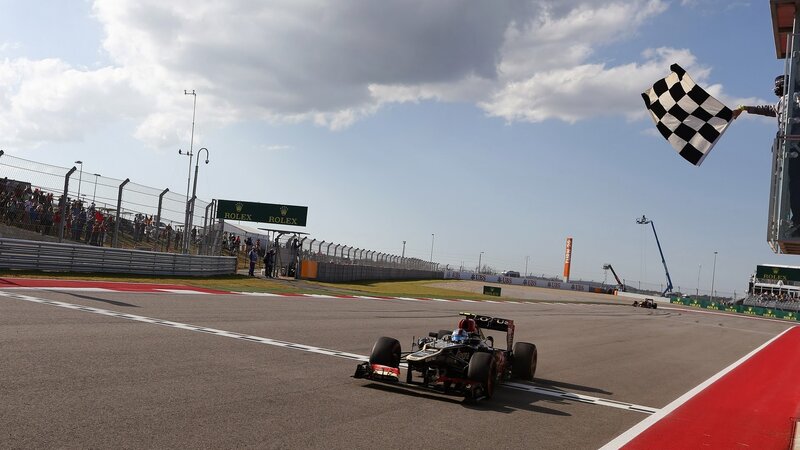 Formula One Car Crossing Finish Line — Gray, Competitive