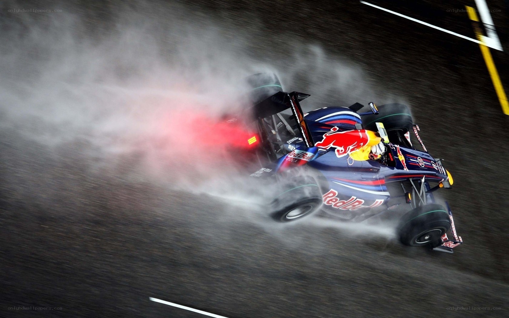 Formula One car drifting in rain