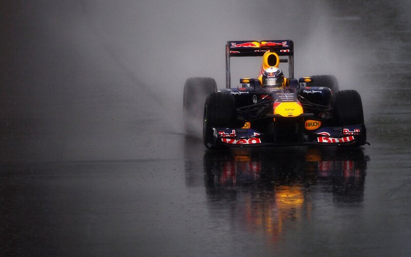 Formula One Car in Rain — Black, Dramatic, Photograph, Driver