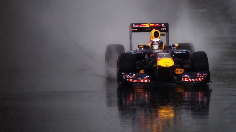 Formula One Car in Rain — Black, Dramatic, Photograph, Driver, Wet Track
