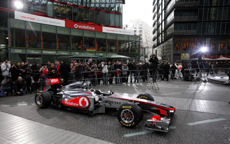 Formula One Car on Display — Silver, Public Event, Afternoon, Photograph