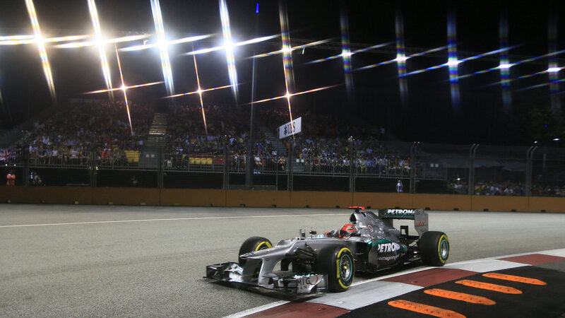 Formula One Car on Track — Black, Dramatic, Night, Photograph, Crowd
