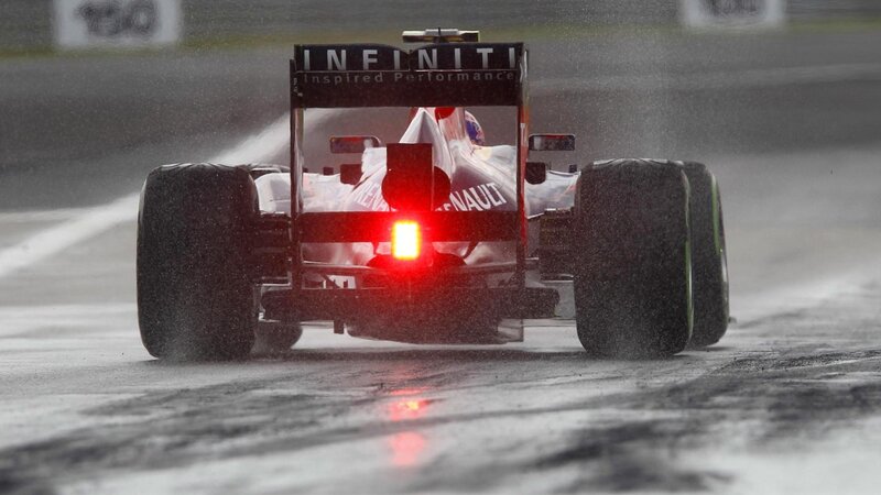 Formula One Car on Track — Black, Dramatic, Photograph, Rain