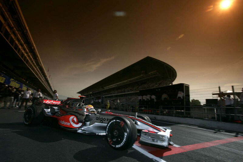 Formula One Car on Track — Black, Dramatic, Sunset