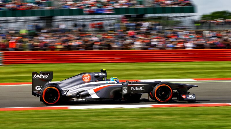 Formula One Car on Track — Black, Dynamic, Afternoon, Photograph, Driver, Crowd, Grass