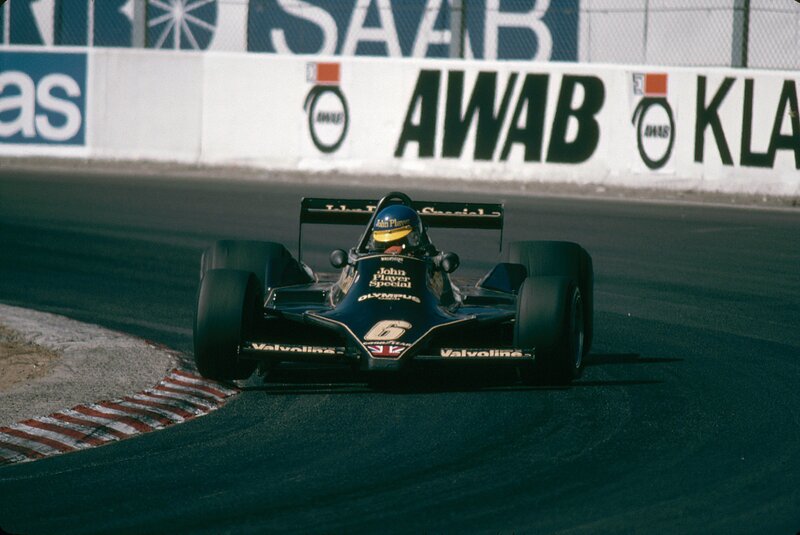 Formula One Car on Track — Black, Dynamic, Afternoon, Photograph, Driver, Race Car, Wall