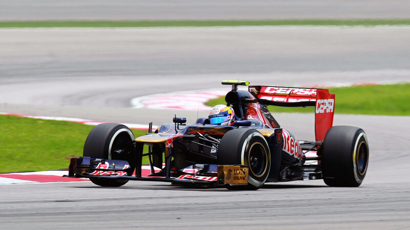 Formula One Car on Track — Black, Dynamic, Afternoon, Photograph, Driver, Racing Tire, Grass