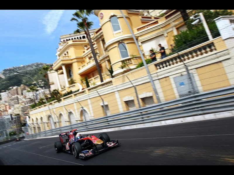 Formula One Car on Track — Black, Dynamic, Afternoon, Photograph, Race Car, Building