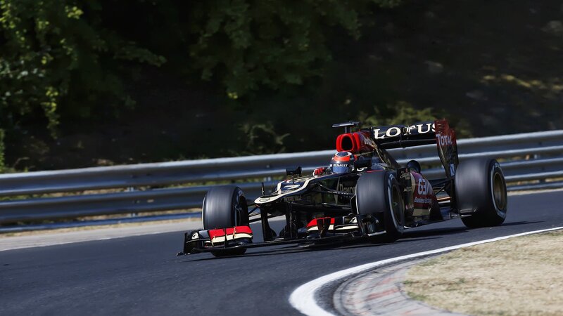Formula One Car on Track — Black, Dynamic, Afternoon, Photograph, Race Car, Driver, Guardrail