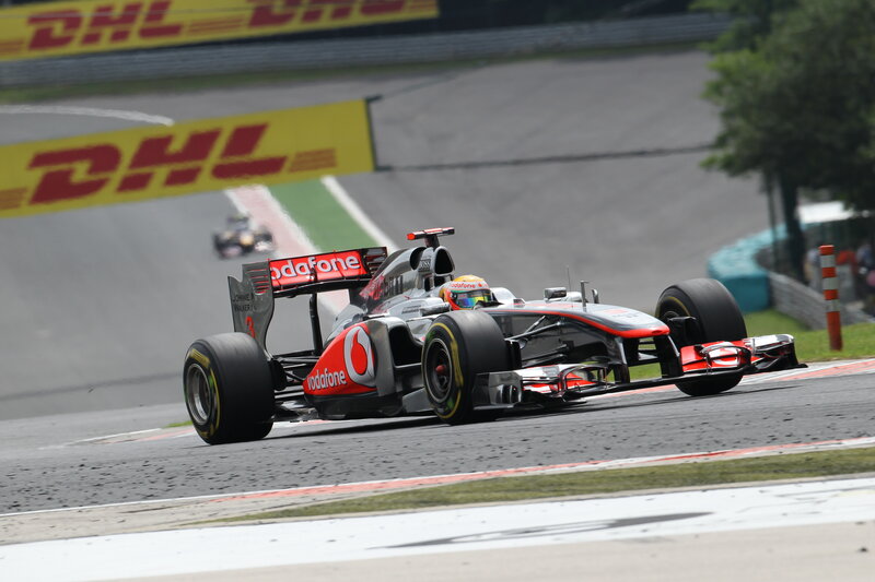 Formula One Car on Track — Black, Dynamic, Afternoon, Photograph, Race Car, Driver