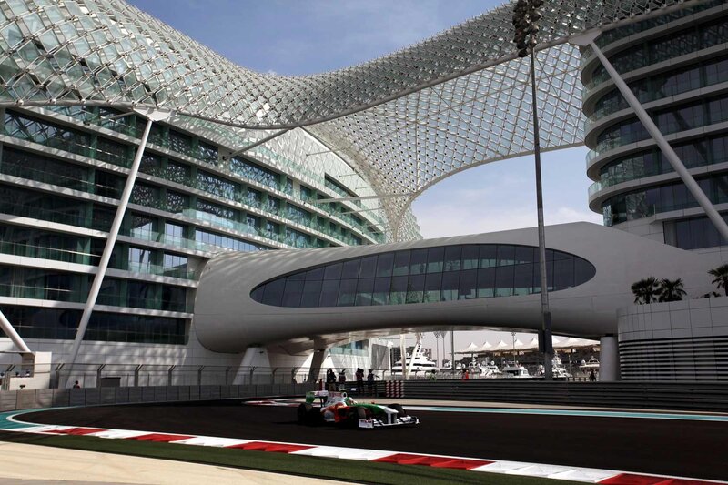 Formula One Car on Track — Black, Dynamic, Afternoon, Photograph, Race Car, Modern Building
