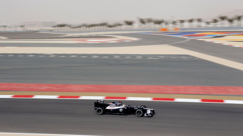 Formula One Car on Track — Black, Dynamic, Afternoon, Photograph, Race Car, Palm Trees
