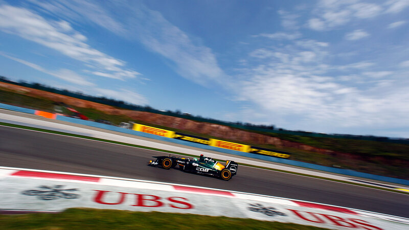 Formula One Car on Track — Black, Dynamic, Afternoon, Photograph, Race Car, Sky