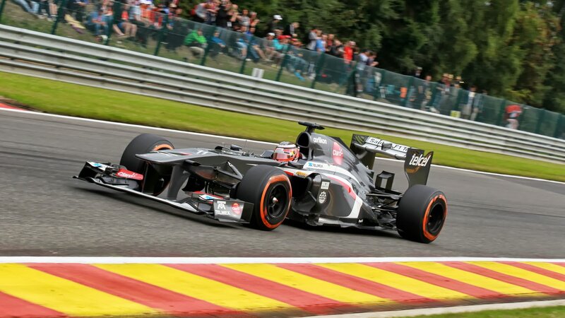 Formula One Car on Track — Black, Dynamic, Afternoon, Photograph, Race Car, Spectators