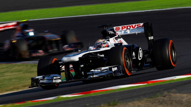 Formula One Car on Track — Black, Dynamic, Afternoon, Photograph, Racing Driver, Race Track, Grass