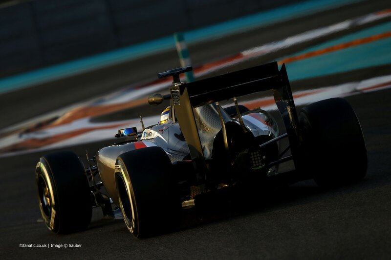 Formula One Car on Track — Black, Dynamic, Night, Photograph, Driver, Racing Circuit