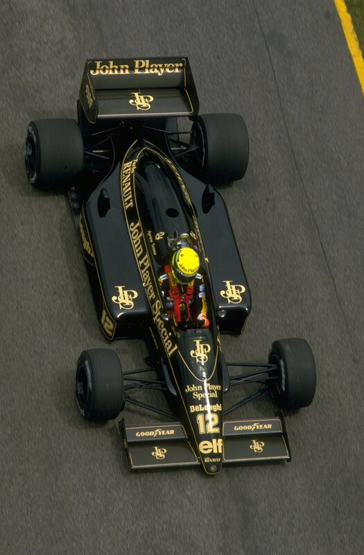 Formula One Car on Track — Black, Dynamic, Photograph, Driver, Racing Car, Gold, Portrait