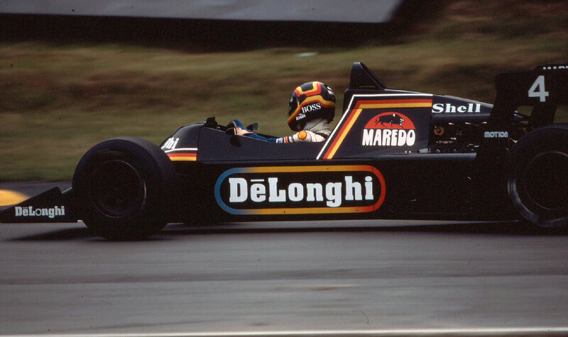 Formula One Car on Track — Black, Dynamic, Photograph, Driver, Racing Car, Helmet