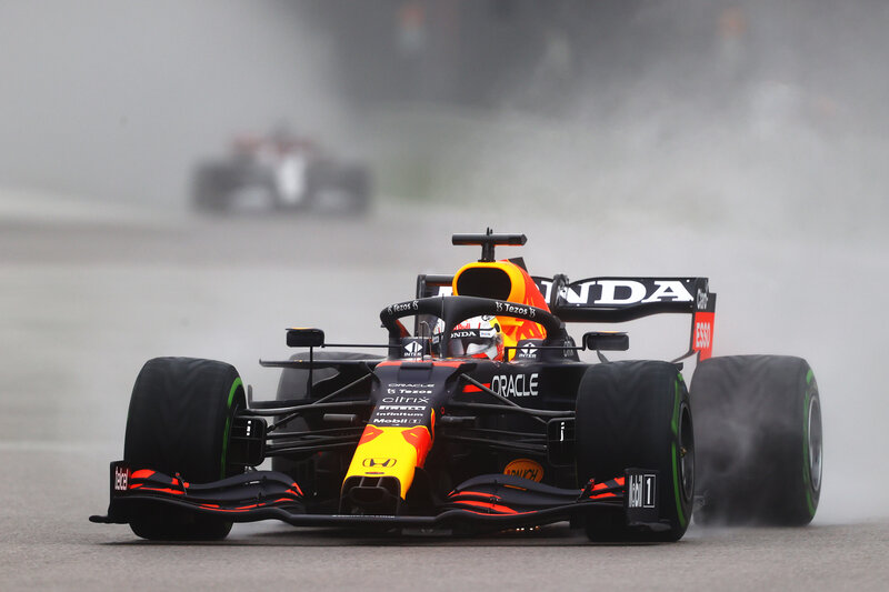 Formula One Car on Track — Black, Dynamic, Photograph, Racing Car, Driver, Tire Smoke
