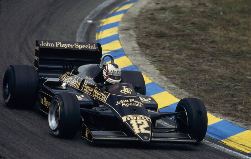 Formula One Car on Track — Black, Dynamic, Photograph, Racing Driver, Race Car, Yellow