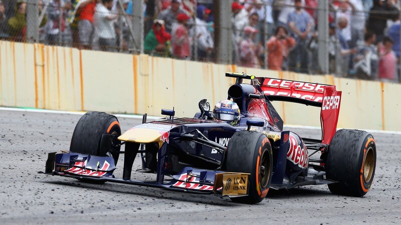 Formula One Car on Track — Blue, Dynamic, Afternoon, Photograph, Driver, Crowd, Fence