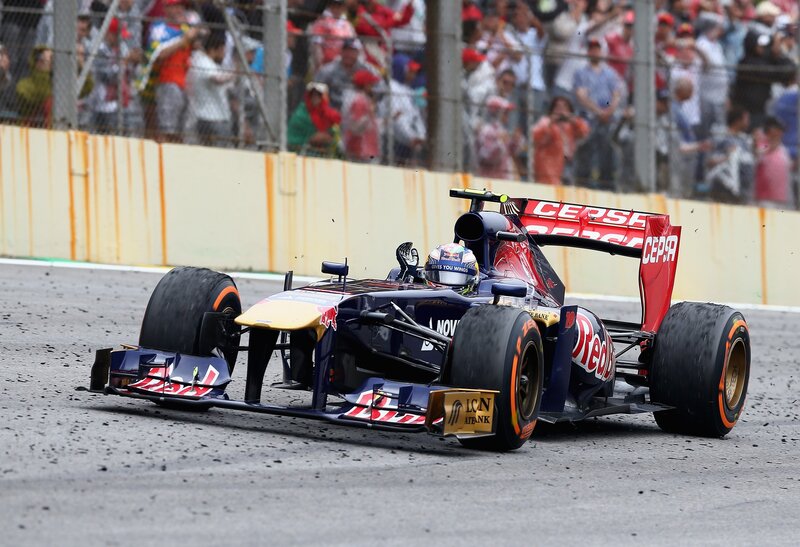 Formula One Car on Track — Blue, Dynamic, Afternoon, Photograph, Driver, Crowd