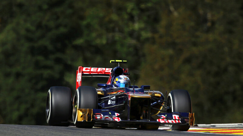 Formula One Car on Track — Blue, Dynamic, Afternoon, Photograph, Driver, Trees