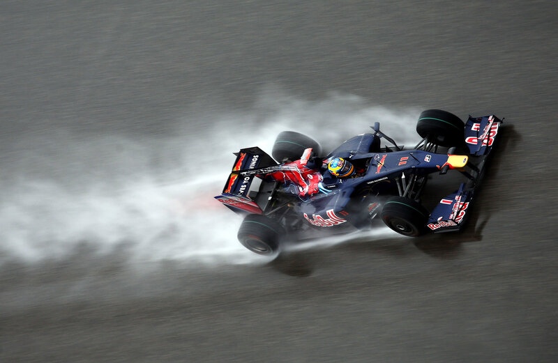 Formula One Car on Track — Blue, Dynamic, Photograph, Driver, Race Car, Tire Smoke