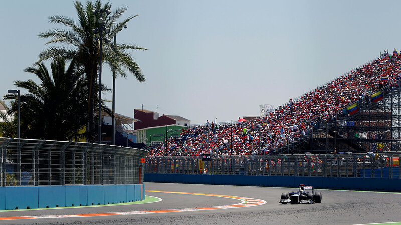 Formula One Car on Track — Gray, Active, Afternoon, Photograph, Crowd