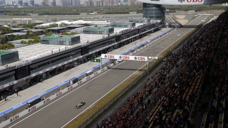 Formula One Car on Track — Gray, Active, Afternoon, Photograph, Race Car
