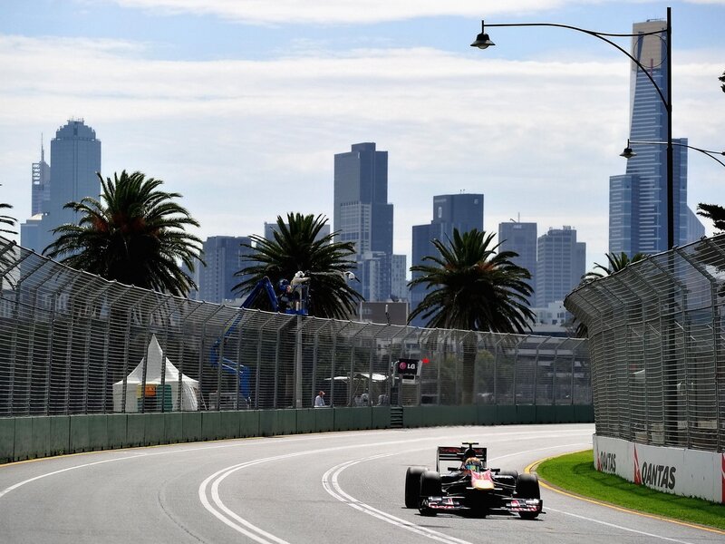 Formula One Car on Track — Gray, Calm, Afternoon, Photograph, Skyscraper