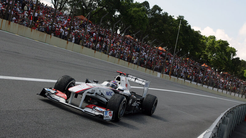 Formula One Car on Track — Gray, Dynamic, Afternoon, Photograph, Crowd