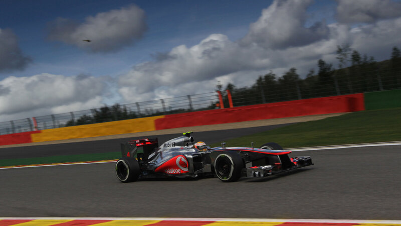 Formula One Car on Track — Gray, Dynamic, Afternoon, Photograph, Driver, Race Car