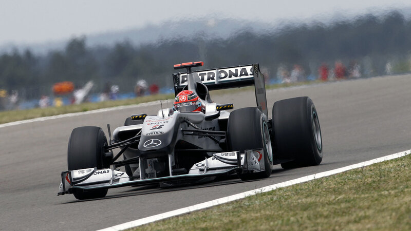 Formula One Car on Track — Gray, Dynamic, Afternoon, Photograph, Driver