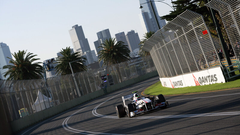 Formula One Car on Track — Gray, Dynamic, Afternoon, Photograph, Palm Trees