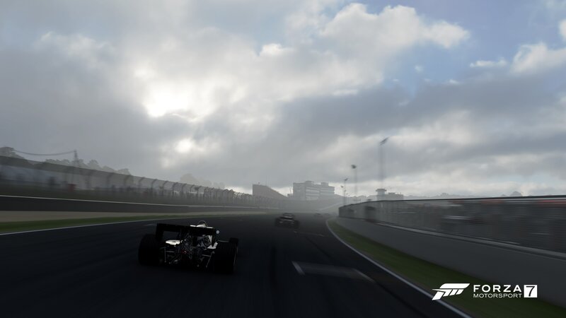 Formula One Car on Track — Gray, Overcast, Afternoon