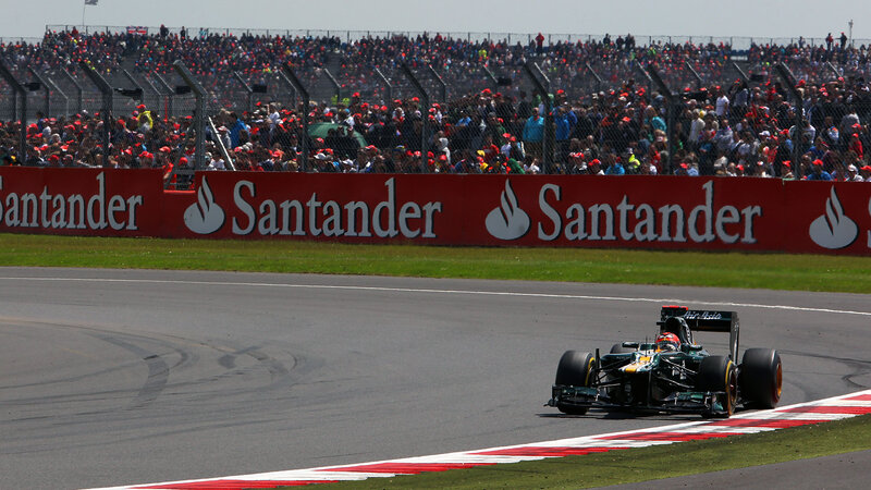 Formula One Car on Track — Green, Active, Afternoon, Photograph, Crowd