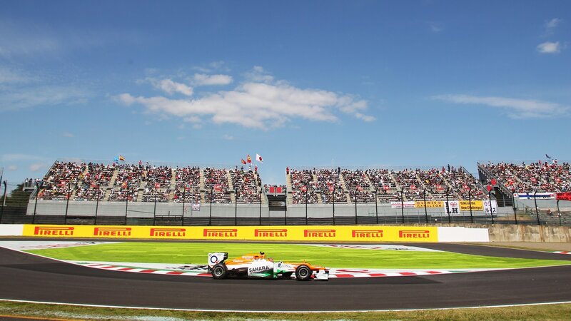 Formula One Car on Track — Green, Active, Afternoon, Photograph, Race Car