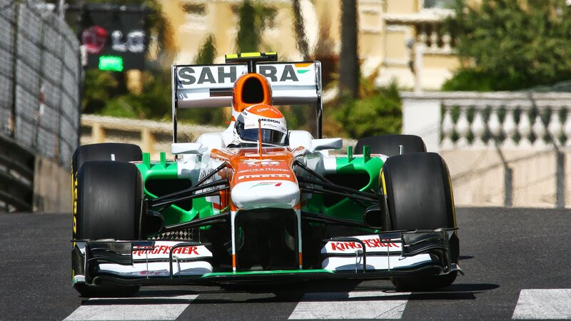 Formula One Car on Track — Green, Dynamic, Afternoon, Photograph, Driver