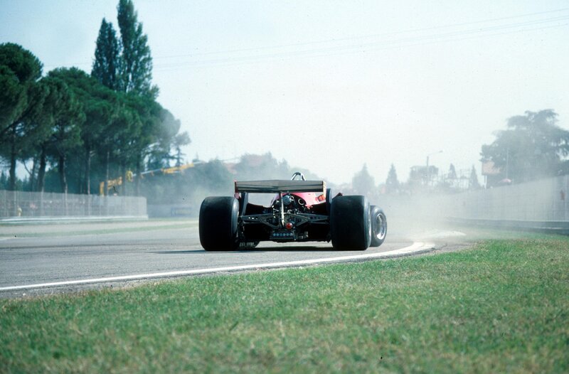 Formula One Car on Track — Green, Dynamic, Afternoon, Photograph, Race Car