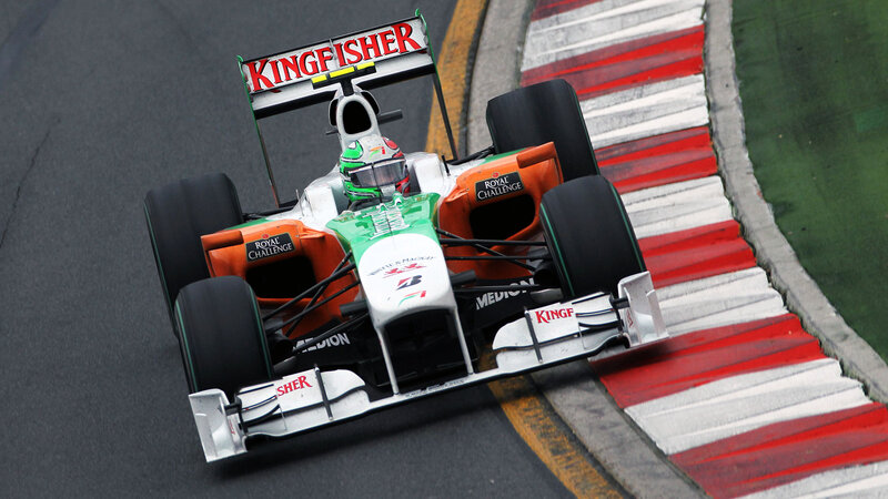 Formula One Car on Track — Green, Dynamic, Photograph