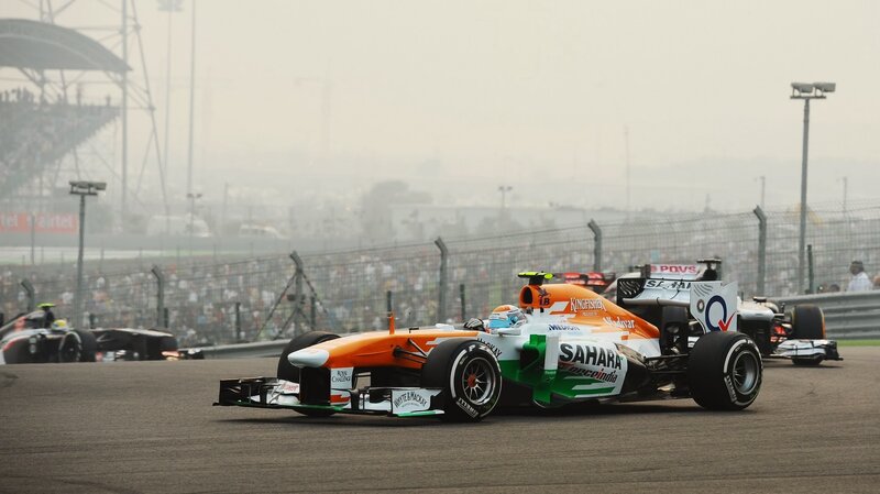Formula One Car on Track — Orange, Competitive, Afternoon