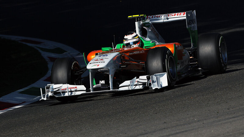 Formula One Car on Track — Orange, Dramatic