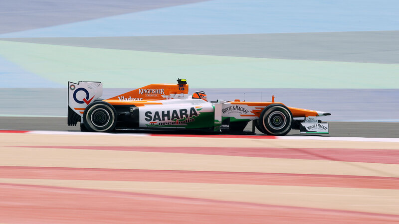 Formula One Car on Track — Orange, Dynamic, Afternoon, Photograph, Driver, Race Car