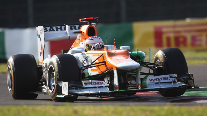 Formula One Car on Track — Orange, Dynamic, Afternoon, Photograph, Driver, Racing Car