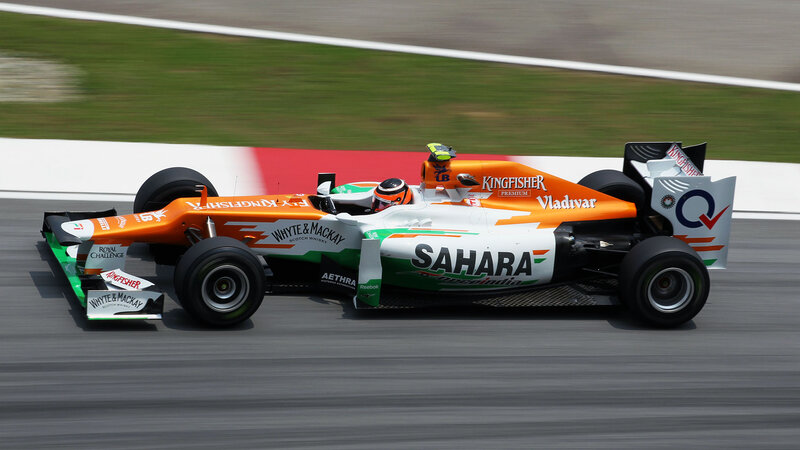 Formula One Car on Track — Orange, Dynamic, Afternoon, Photograph, Driver