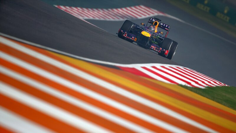 Formula One Car on Track — Orange, Dynamic, Afternoon, Photograph, Race Car, Stripes