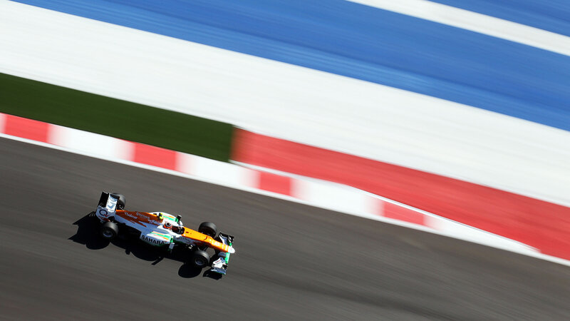 Formula One Car on Track — Orange, Dynamic, Afternoon, Photograph, Race Car