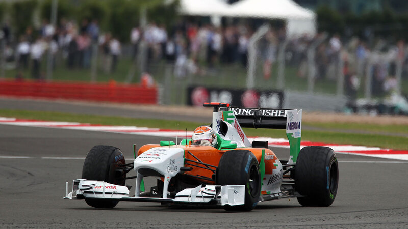 Formula One Car on Track — Orange, Dynamic, Afternoon